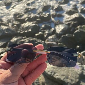 Used Cartièr gold and white wood frames unisex usually worn by males